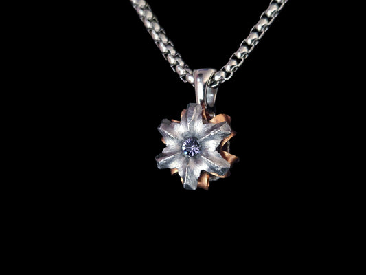 Floral pendant necklace on a black background