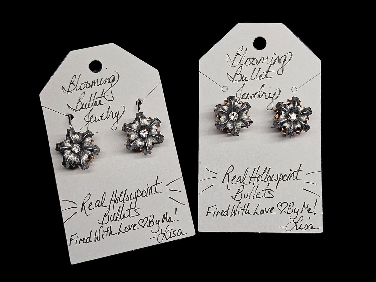 Pair of silver flower-shaped earrings on Blooming Bullet Jewelry tags.